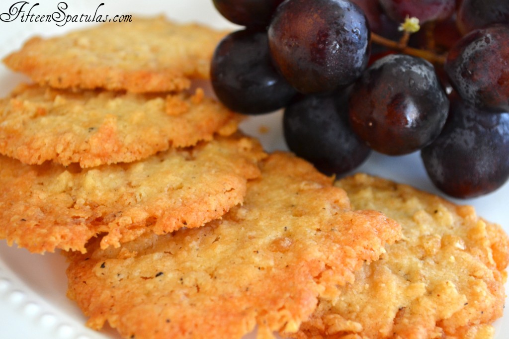 Cheese Crisps - On Plate with Red Grapes on Side