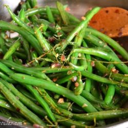 Thanksgiving Green Beans - In Stainless Steel Skillet with Thyme and Wooden Spoon