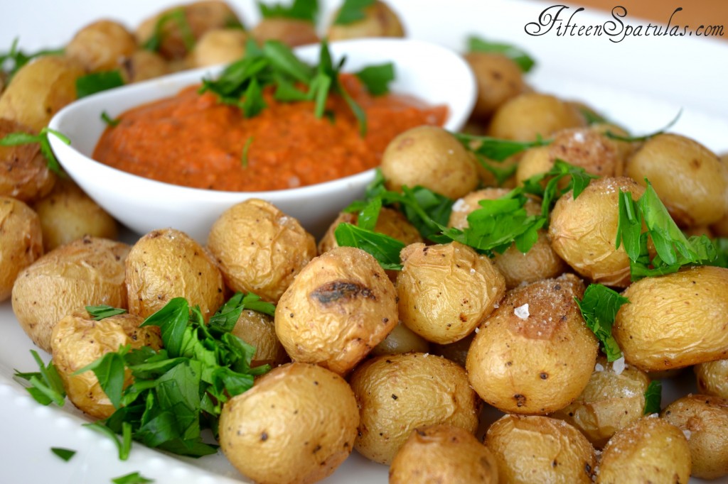 Roasted Baby Potatoes - on White Dish with Romesco Dip in Ramekin and Parsley Sprinkled on Top
