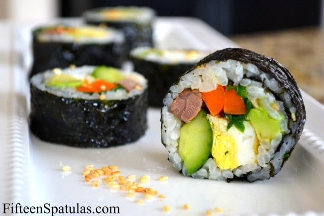 Kim Bap - Korean Sushi Rolls filled with Beef, Cucumber, Carrot, Eggs, and More