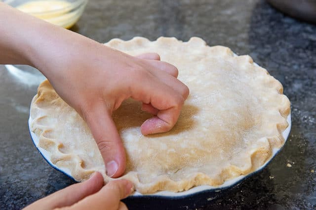 Crimping the Double Crust Shut with Fingers and Thumb
