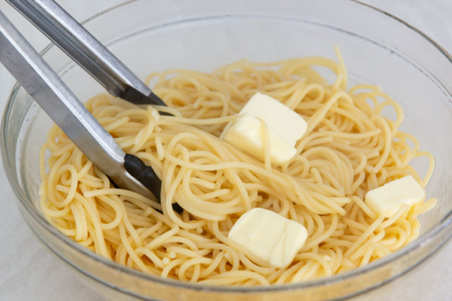 Spaghetti in a Bowl with Pats of Butter