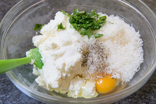 Ricotta Cheese in Bowl With Parmesan, Basil, Pepper, and Egg