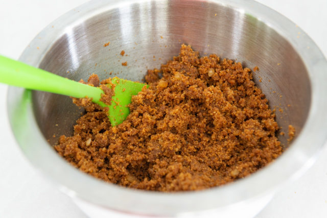 Gingersnap Cookie Crust in a Mixing Bowl with Spatula