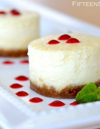 Mini Cheesecakes with Gingersnap Crust and Raspberry Sauce