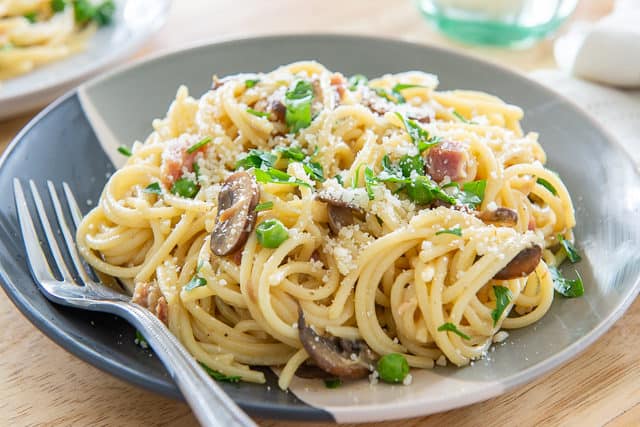 Pasta Carbonara With Peas - On Plate with Spaghetti, Pancetta, and Mushrooms