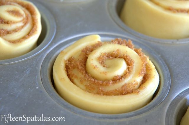 Raw Sticky Buns Roll in Muffin Tin With Cinnamon Sugar Filling