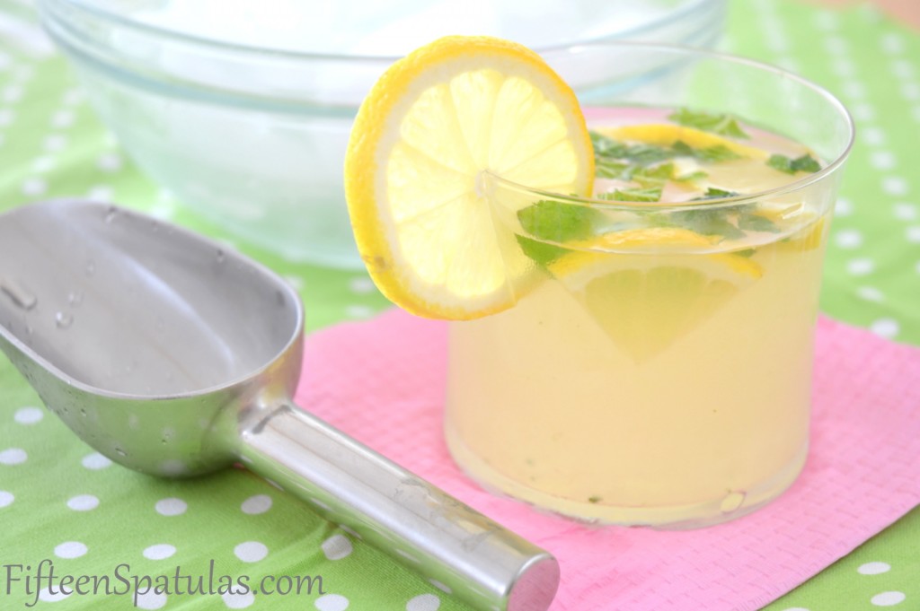 Muddled Lemonade - Garnished with Lemon Slice with ice in Background