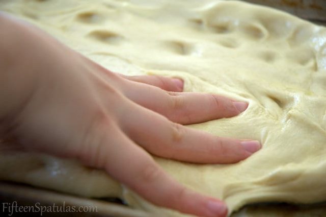 Focaccia Dough with Fingers Spreading It