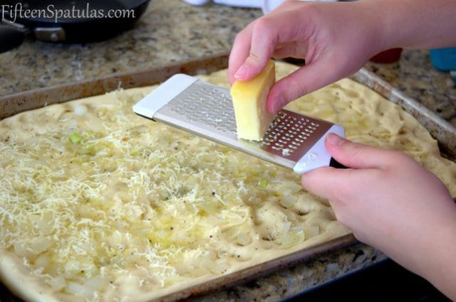 Grating Gruyere Cheese On Top of Dough