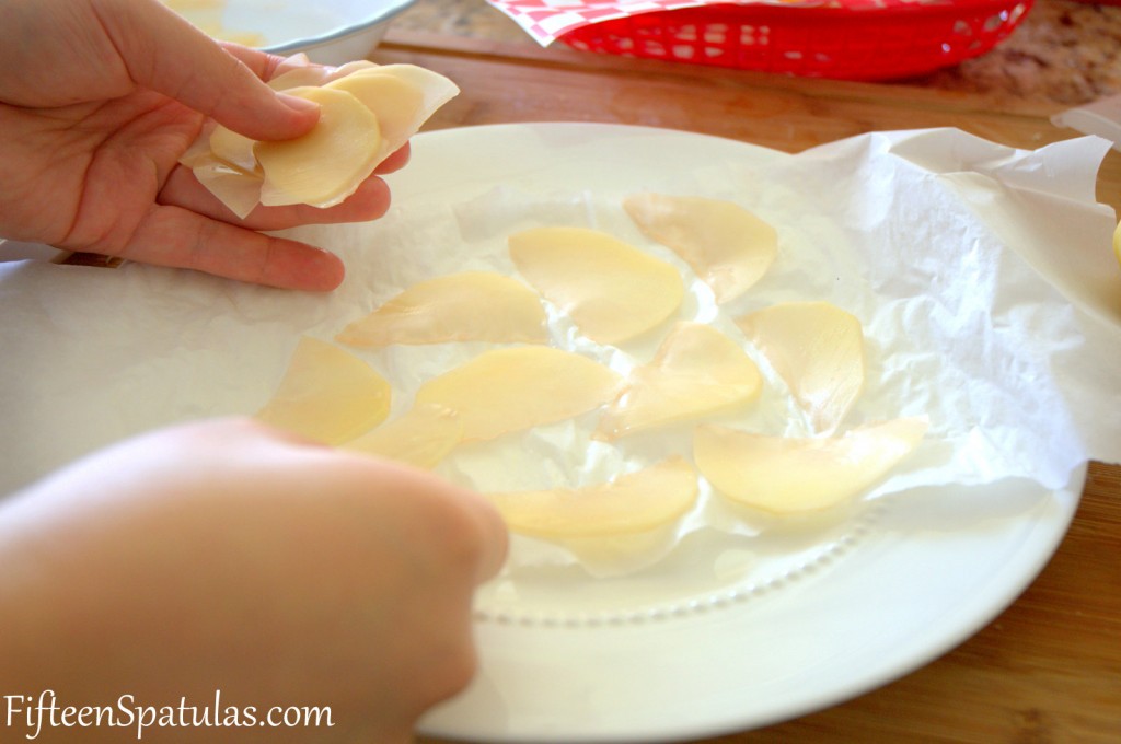 Laying Potato Slices on Paper Towel Lined Plate