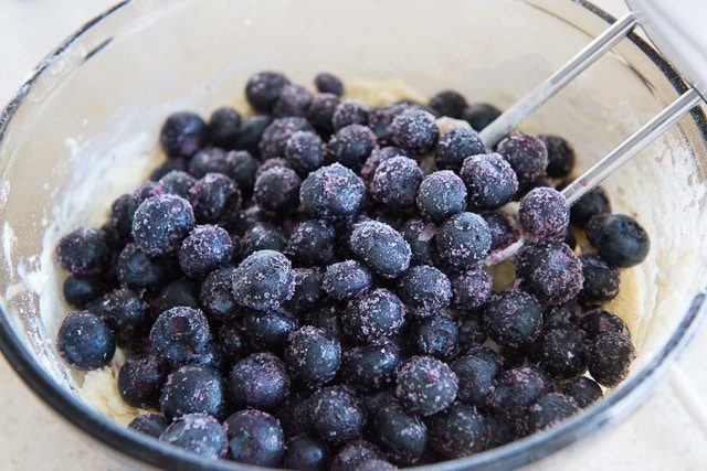 Frozen Blueberries Added to Batter in Bowl