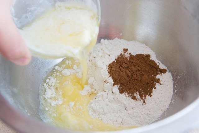 Flour, Cinnamon, and Melted Butter Pouring Into Bowl