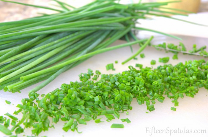 Finely Chopped Chives on Cutting Board