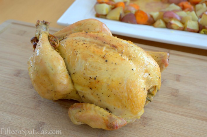 Roasted Whole Chicken on a Board with Vegetables 