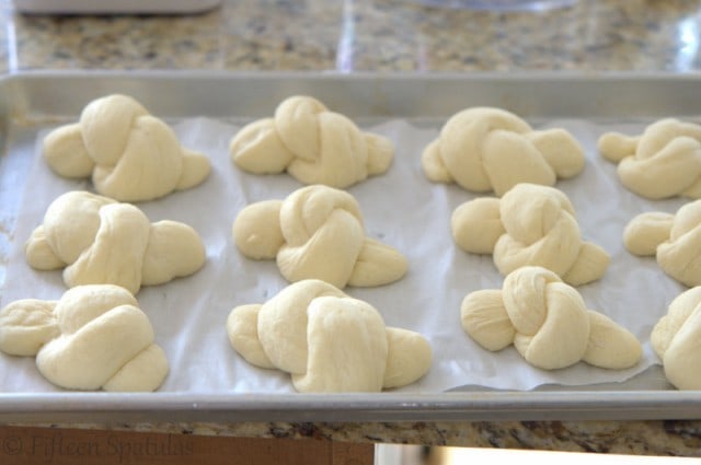 Tied Garlic Knots on Parchment Lined Sheet Pan