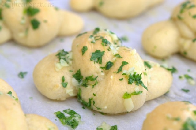 Close Up Of Garlic Knots with Parsley and Butter on It