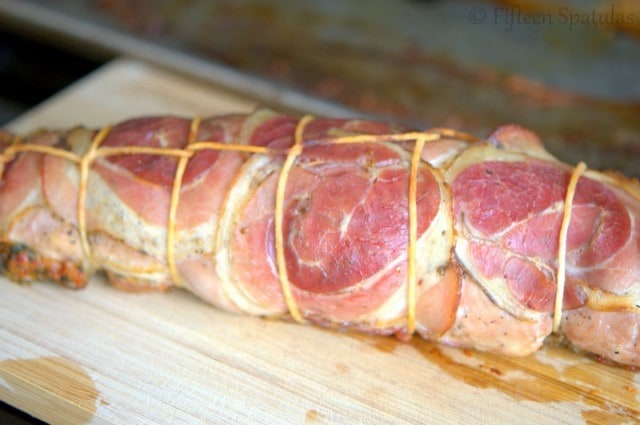 Pancetta Wrapped Pork Fully Cooked on Cutting Board