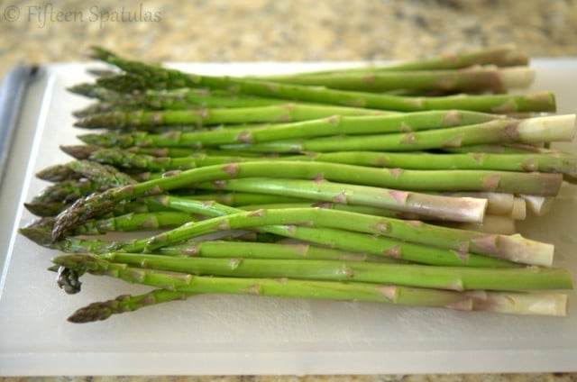 Rinsed Asparagus Spears on Cutting Board