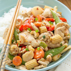 Chicken Stir Fry in Blue Bowl with Rice and Chopsticks