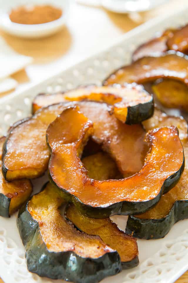 Roasted Acorn Squash - Presented on a Lacy White Platter on Wooden Board