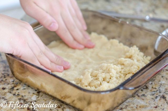 Pressing Shortbread Bar Dough Into Square Dish with Fingers