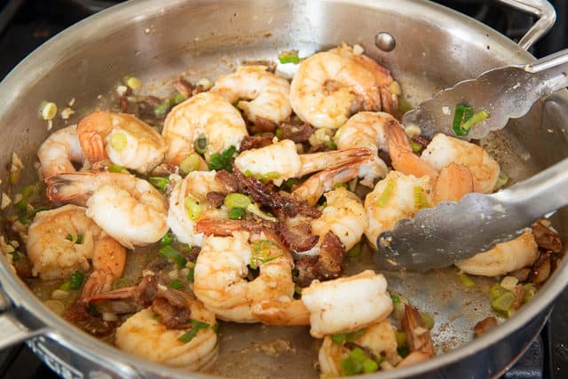 Tossing the Shrimp and Grits Sauce Together in Skillet