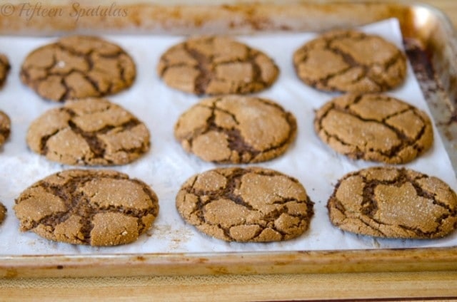 crinkled ginger molasses cookies on parchment paper 