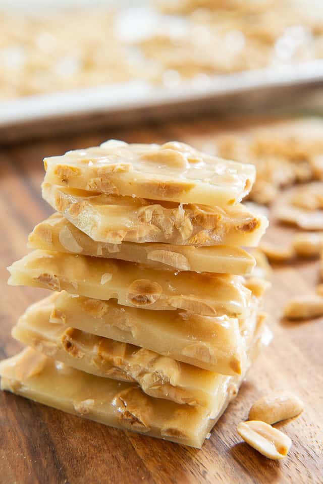 Peanut Brittle Recipe -Stacked on a Wooden Board