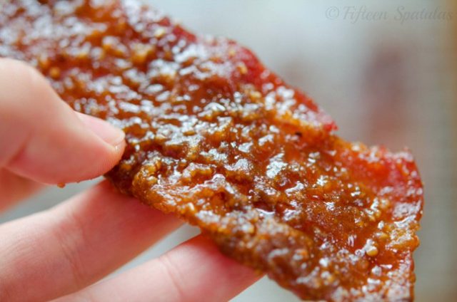 close up of brown sugar caramelized praline bacon with nuts