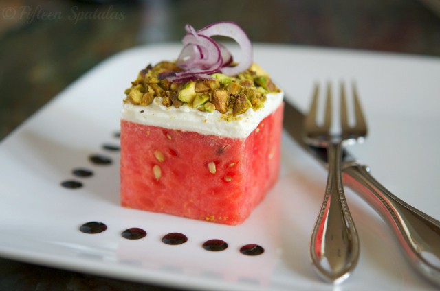 watermelon cube with goat cheese, pistachios, red onion, and balsamic