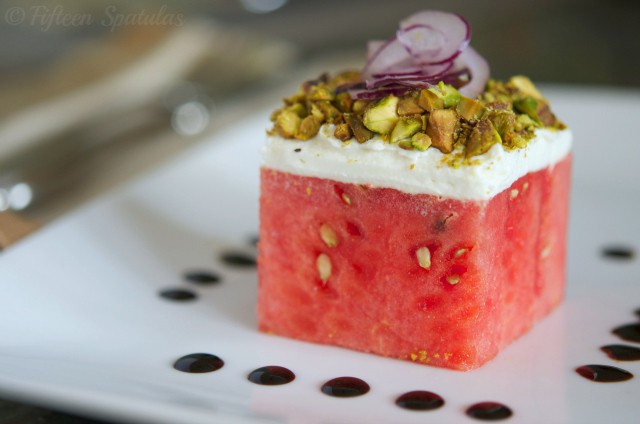 stacked watermelon salad with goat cheese, pistachios, red onion, balsamic