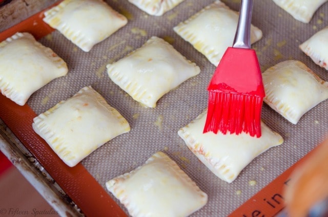 Puff Pastry Pizza Bites on Baking Sheet Brushed with Egg Wash