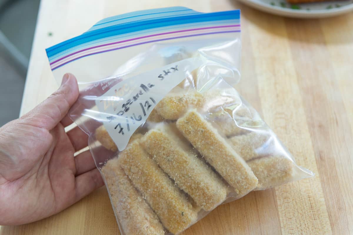 Frozen Mozzarella sticks in a Ziploc bag for storage