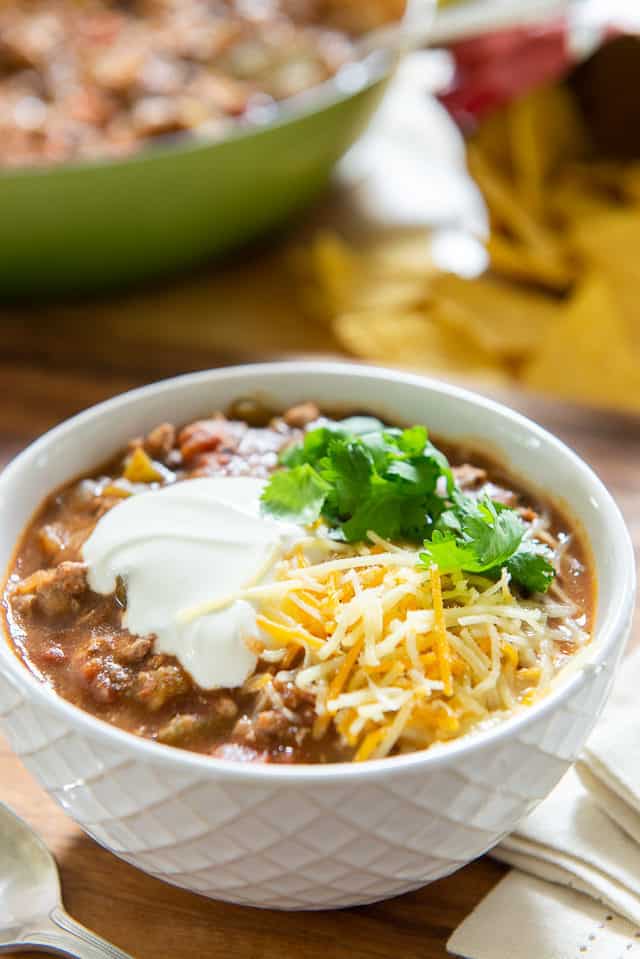 Turkey Chili - In a Bowl Garnished with Sour Cream, Cheese, and Cilantro