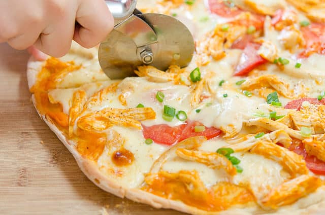 Buffalo Chicken Pizza - Cut with a Pizza Cutter on Wooden Board