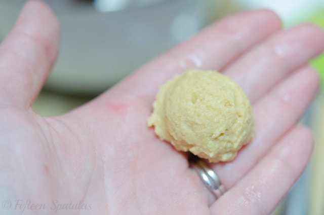 a scoop of chickpea fritter batter in a hand