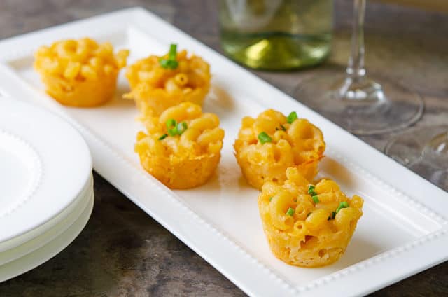 Mini Mac and Cheese Cups - on White Platter with Wine in Background
