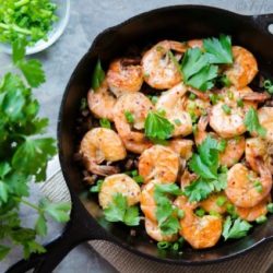Peel and Eat Shrimp In Cast Iron Skillet with Scallions and Parsley On Top