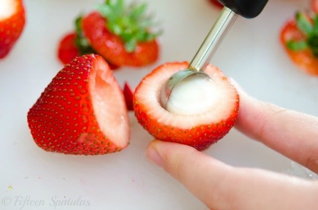 Using a Melon Baller to Scoop Out Core of Strawberry