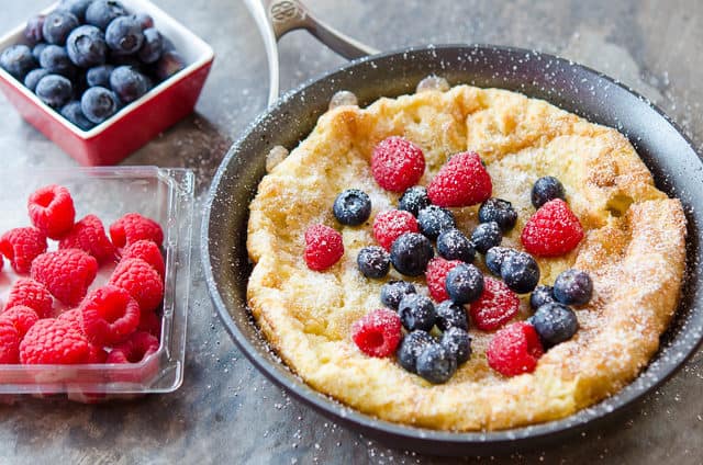 Dutch Baby - Topped with Fresh Raspberries and Blueberries in a Skillet