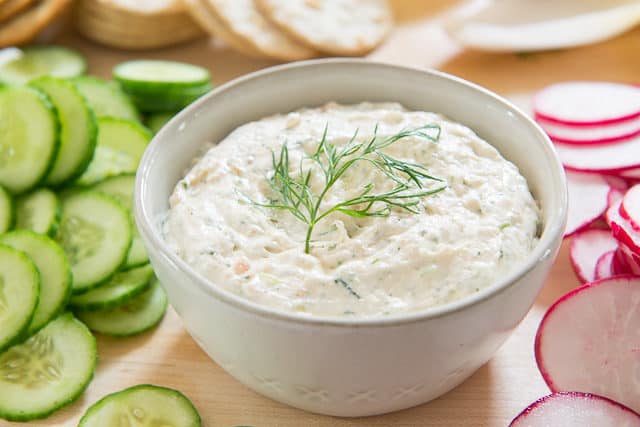 Salmon Spread Recipe - in White bowl and Dill Garnish With Crackers, Vegetables on Board