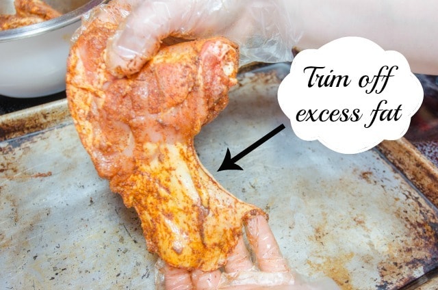 Showing Excess Chicken Thigh Fat to be Trimmed
