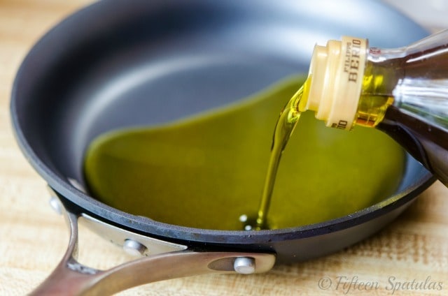Pouring Olive Oil Into Skillet