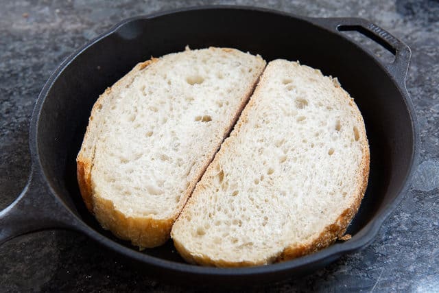 Two Slices of Bread in Cast Iron Skillet