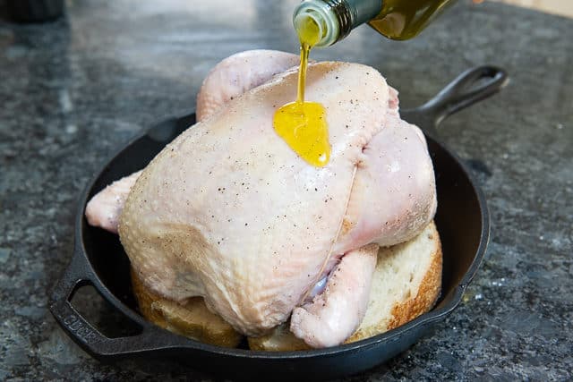Pouring Olive Oil on Chicken
