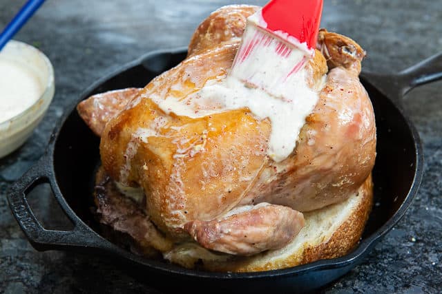 Brushing Creme Fraiche on a Whole Oven Roasted Chicken