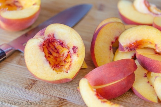 Fresh Cut Peaches on a Wooden Board