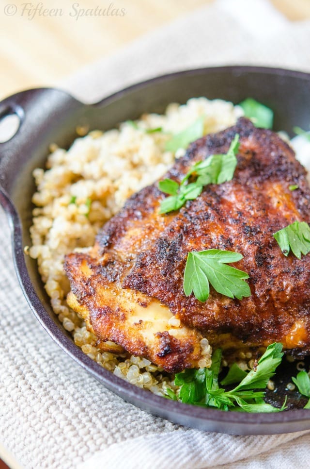 Spice Rubbed Chicken Thigh - Sprinkled with Parsley and Plated with Quinoa