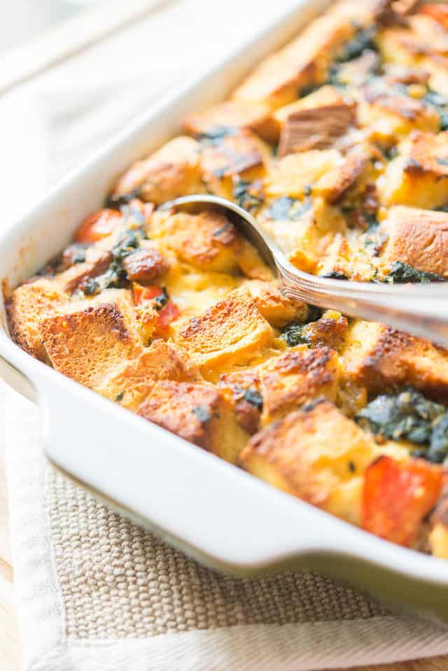 Sausage Breakfast Casserole - In a Green Dish with Spoon